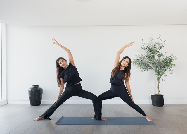 Ami and Vicky in warrior pose